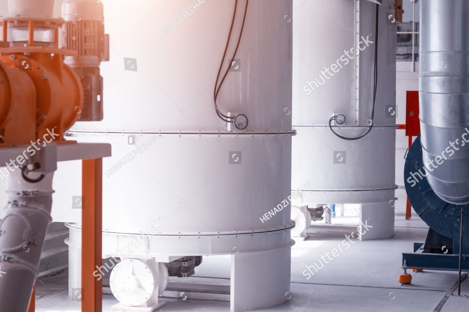 stock-photo-modern-plant-for-the-processing-and-production-of-food-flour-large-tanks-in-the-shop-for-the-1214342119